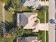 Aerial view of the house showing its layout, screened pool, landscaping, and relation to the neighborhood at 6456 Cypress Springs Pkwy, Port Orange, FL 32128