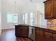 Bright kitchen with island bar, stainless appliances, and natural light at 6456 Cypress Springs Pkwy, Port Orange, FL 32128