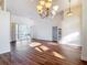 Expansive living area with wood flooring, vaulted ceilings, and an open layout perfect for entertaining at 6456 Cypress Springs Pkwy, Port Orange, FL 32128