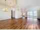 Spacious living area with sleek floors, modern lighting, and sliding glass doors offering scenic views at 6456 Cypress Springs Pkwy, Port Orange, FL 32128