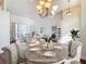 Virtually staged living room with dining area, offering a bright and airy feel and modern design at 6456 Cypress Springs Pkwy, Port Orange, FL 32128