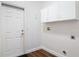 Practical mud room with direct exterior access, ample cabinet space, and durable flooring at 6456 Cypress Springs Pkwy, Port Orange, FL 32128