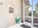 Enclosed patio features a screen door, providing access to the outdoors and enhancing the living space at 6456 Cypress Springs Pkwy, Port Orange, FL 32128