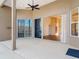 Inviting covered patio with a ceiling fan, offering a view of the home's interior and adjacent outdoor areas at 6456 Cypress Springs Pkwy, Port Orange, FL 32128