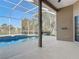 Enclosed pool area with a screened enclosure, providing a relaxing outdoor space with privacy and a view at 6456 Cypress Springs Pkwy, Port Orange, FL 32128