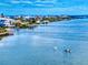 Aerial image showcasing kayakers on a bay in a coastal neighborhood at 6584 Engram Rd # 405, New Smyrna Beach, FL 32169