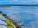 Scenic aerial view of waterfront condos featuring private docks and beautiful water views at 6584 Engram Rd # 405, New Smyrna Beach, FL 32169