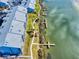 Aerial view of waterfront condos with private docks and well-maintained landscaping at 6584 Engram Rd # 405, New Smyrna Beach, FL 32169