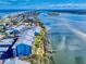 Scenic aerial view of waterfront condos featuring private docks and beautiful water views at 6584 Engram Rd # 405, New Smyrna Beach, FL 32169