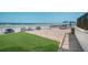 Picturesque beach access patio with ocean views, ideal for relaxing and enjoying coastal breezes at 701 S Atlantic Ave # 11, New Smyrna Beach, FL 32169