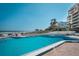 Stunning pool with ocean views, inviting you to relax and enjoy the coastal lifestyle at 701 S Atlantic Ave # 11, New Smyrna Beach, FL 32169