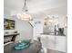 Cozy dining area with modern lighting, adjacent to the kitchen, offering a comfortable space at 701 S Atlantic Ave # 11, New Smyrna Beach, FL 32169