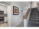 Hallway leading to stairs with kitchen and living room visible at 701 S Atlantic Ave # 11, New Smyrna Beach, FL 32169