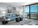 Inviting living room with stylish décor, a comfortable sofa, and a scenic balcony view at 701 S Atlantic Ave # 11, New Smyrna Beach, FL 32169