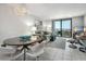 Bright living room with stylish furnishings, balcony access, and beautiful ocean views at 701 S Atlantic Ave # 11, New Smyrna Beach, FL 32169