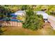 Aerial view showcasing backyard with privacy fence, pool, and wooden deck at 725 Ingham Rd, New Smyrna Beach, FL 32168