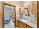 Bathroom featuring a sink with granite countertops and wood cabinets at 725 Ingham Rd, New Smyrna Beach, FL 32168