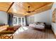 Bedroom with wood paneled ceiling and sliding glass doors that allow lots of light into the room at 725 Ingham Rd, New Smyrna Beach, FL 32168