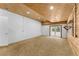 Spacious carpeted bonus room with wood ceiling, a mirror accent wall, and walk-out at 725 Ingham Rd, New Smyrna Beach, FL 32168