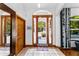 A charming foyer with front door view, tile floors, and stylish decor at 725 Ingham Rd, New Smyrna Beach, FL 32168