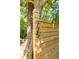 A wooden gatepost displaying the house number '725' in a natural, wooded setting at 725 Ingham Rd, New Smyrna Beach, FL 32168