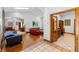 Spacious living area with wood floors, open layout, and ample natural light at 725 Ingham Rd, New Smyrna Beach, FL 32168