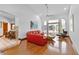 Comfortable living room with ample seating, wood floors, and sliding glass doors at 725 Ingham Rd, New Smyrna Beach, FL 32168