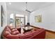 Bright living room with unique decor, hardwood floors, and open access to outdoor area at 725 Ingham Rd, New Smyrna Beach, FL 32168