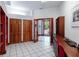 A spacious office with natural light, wood cabinets, and tile flooring, perfect for a home workspace at 725 Ingham Rd, New Smyrna Beach, FL 32168