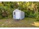 Small backyard storage shed with single door and window at 725 Ingham Rd, New Smyrna Beach, FL 32168