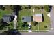Birds eye view of home and neighboring houses showing the landscaping, roof, and driveways at 902 Conrad Dr, New Smyrna Beach, FL 32168