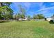 Large back yard surrounded by fence and foliage at 902 Conrad Dr, New Smyrna Beach, FL 32168
