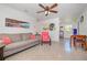 Bright living room featuring a comfortable couch, stylish decor, and plenty of natural light at 902 Conrad Dr, New Smyrna Beach, FL 32168