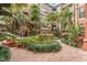 Lush courtyard with a variety of plants and trees, creating a tranquil oasis for residents to enjoy at 911 N Orange Ave # 528, Orlando, FL 32801