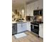 Stylish modern kitchen with quartz countertops, stainless steel appliances and decorative touches at 911 N Orange Ave # 528, Orlando, FL 32801