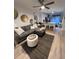 Contemporary living space featuring sleek decor, a comfortable couch, and natural light from the kitchen at 911 N Orange Ave # 528, Orlando, FL 32801