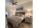 Comfortable main bedroom features a queen bed with patterned bedding and wood laminate flooring at 911 N Orange Ave # 528, Orlando, FL 32801