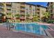 Inviting swimming pool surrounded by lush landscaping and comfortable lounge chairs, perfect for relaxation at 911 N Orange Ave # 528, Orlando, FL 32801