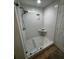 Walk-in shower with grey stone floor and white subway tile surround at 911 N Orange Ave # 528, Orlando, FL 32801