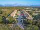 Aerial view of townhomes showcases lush landscaping and well-maintained exteriors, highlighting community appeal at 94 Bella Vita Way, Ormond Beach, FL 32174