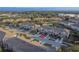 Aerial view of townhomes showcases well-manicured lawns, driveways, and ample parking, highlighting community appeal at 94 Bella Vita Way, Ormond Beach, FL 32174