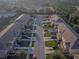 Overhead view of townhomes showing neighborhood streets and manicured lawns at 94 Bella Vita Way, Ormond Beach, FL 32174