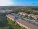 Aerial view of townhomes surrounded by lush greenery and trees, showcasing the serene community and landscape at 94 Bella Vita Way, Ormond Beach, FL 32174