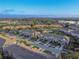 Aerial view of the townhome community shows lush landscaping, trees, and a serene environment with easy access at 94 Bella Vita Way, Ormond Beach, FL 32174