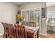Dining room featuring a large wooden table with seating for eight and a bright, natural light at 94 Bella Vita Way, Ormond Beach, FL 32174