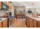 Modern kitchen with stainless steel appliances and a large island with seating at 94 Bella Vita Way, Ormond Beach, FL 32174