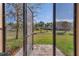 Open screened lanai showcases the well-maintained backyard and mature landscaping at 94 Bella Vita Way, Ormond Beach, FL 32174