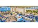 Panoramic aerial view of the condominium complex near a waterway, featuring ample parking and coastal charm at 101 N Riverside Dr # 214, New Smyrna Beach, FL 32169