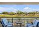 This balcony offers a serene escape with picturesque canal views and comfortable seating, perfect for relaxation at 101 N Riverside Dr # 214, New Smyrna Beach, FL 32169