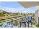 Enjoy beautiful water views from this cozy balcony featuring comfortable seating and a peaceful atmosphere at 101 N Riverside Dr # 214, New Smyrna Beach, FL 32169